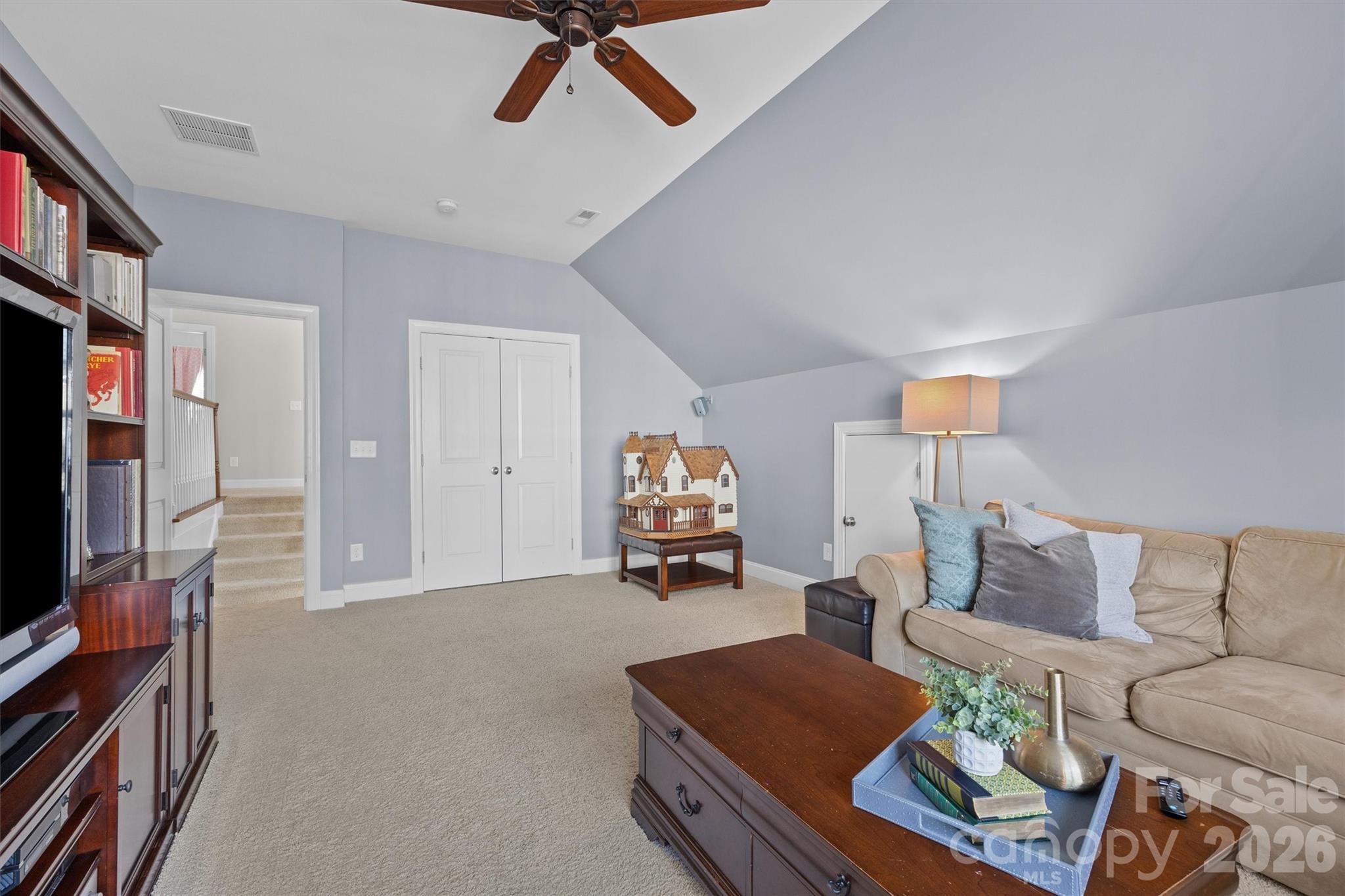 954 Castlewatch Drive Fort Mill, SC 29708 - Photo 20 of 45 a living room with furniture and a flat screen tv