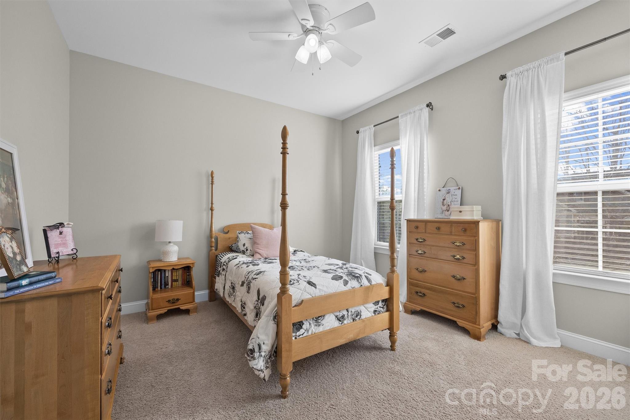 954 Castlewatch Drive Fort Mill, SC 29708 - Photo 26 of 45 a bedroom with a bed and a cabinets