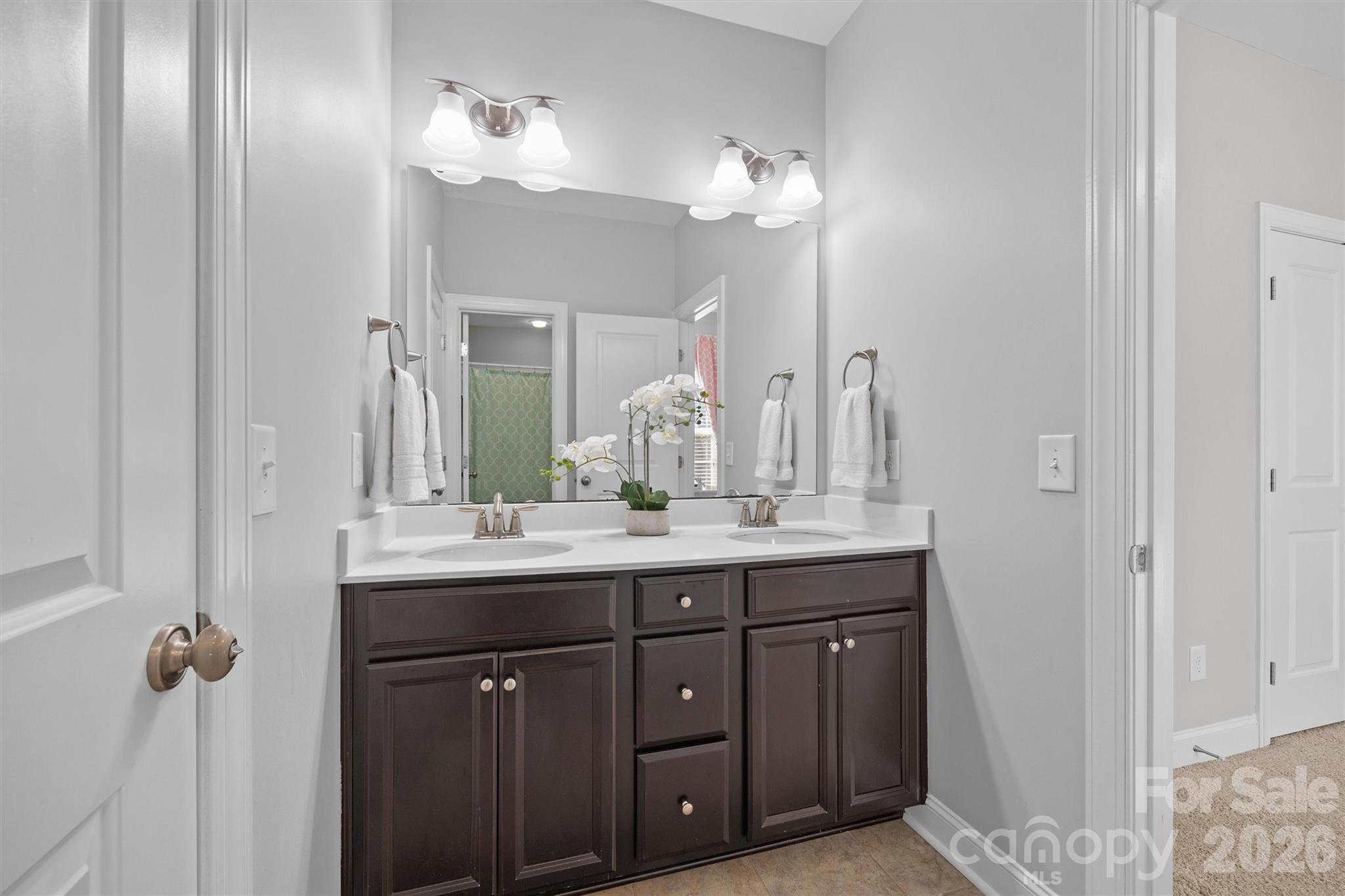 954 Castlewatch Drive Fort Mill, SC 29708 - Photo 30 of 45 a bathroom with a double vanity sink and a mirror