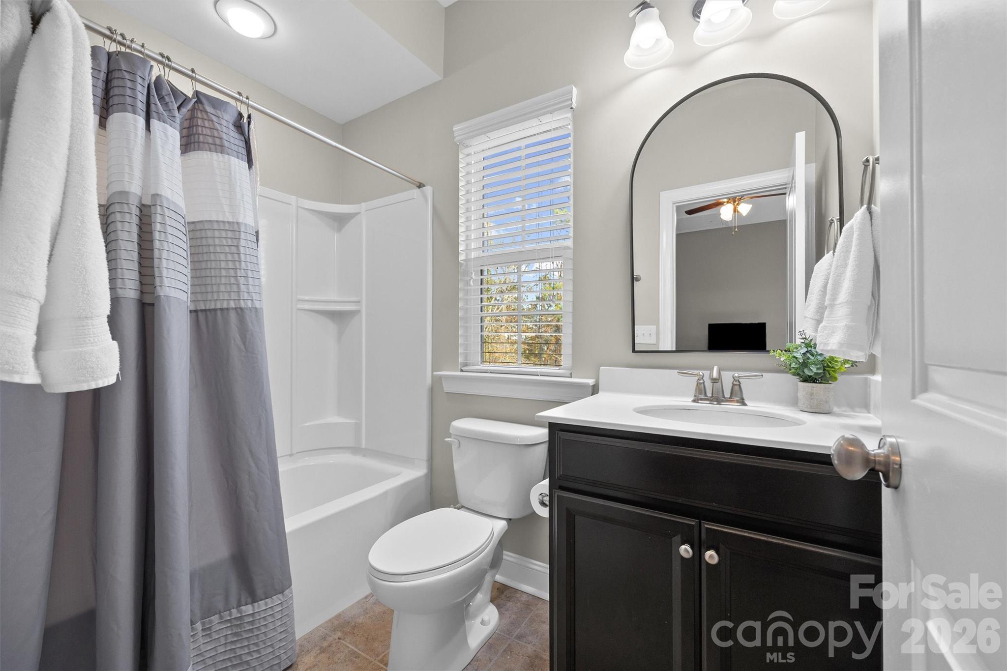 954 Castlewatch Drive Fort Mill, SC 29708 - Photo 34 of 45 a bathroom with a sink a toilet and shower