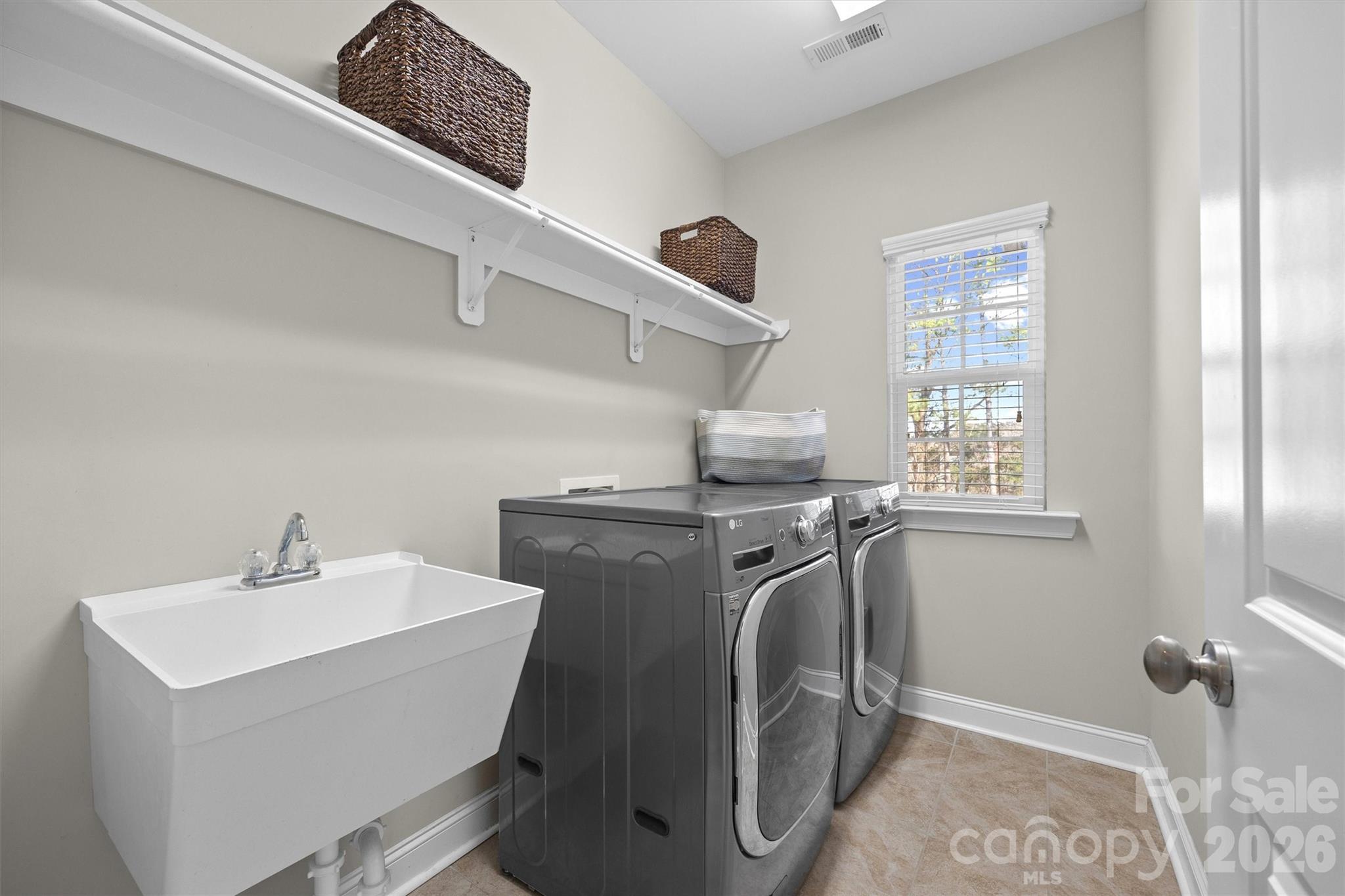 954 Castlewatch Drive Fort Mill, SC 29708 - Photo 35 of 45 a utility room with dryer and washer