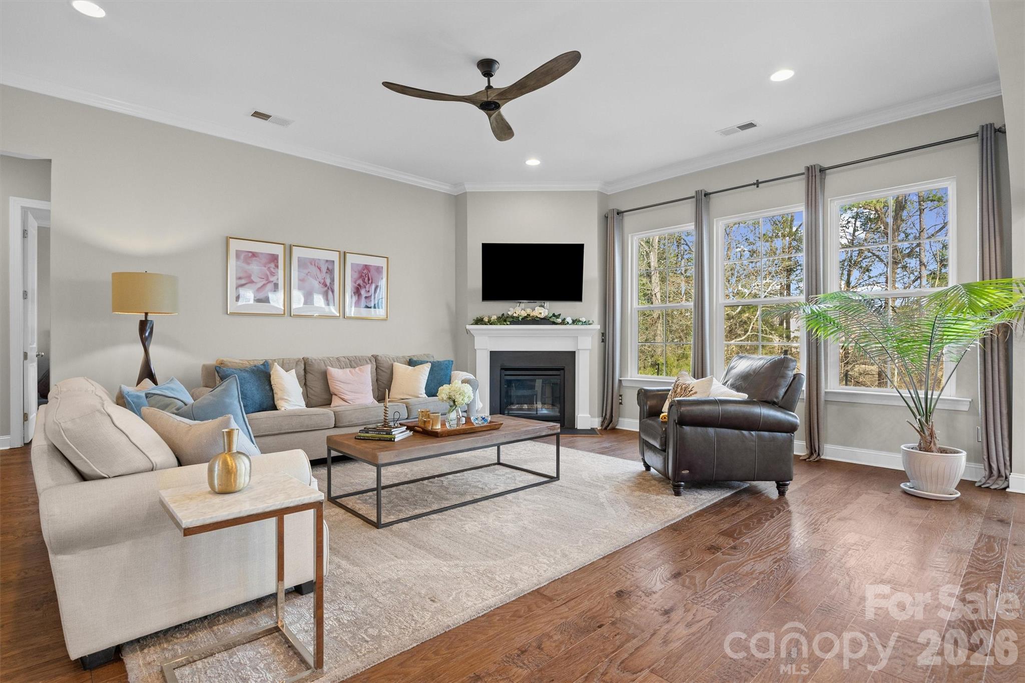 954 Castlewatch Drive Fort Mill, SC 29708 - Photo 7 of 45 a living room with furniture fireplace and a large window
