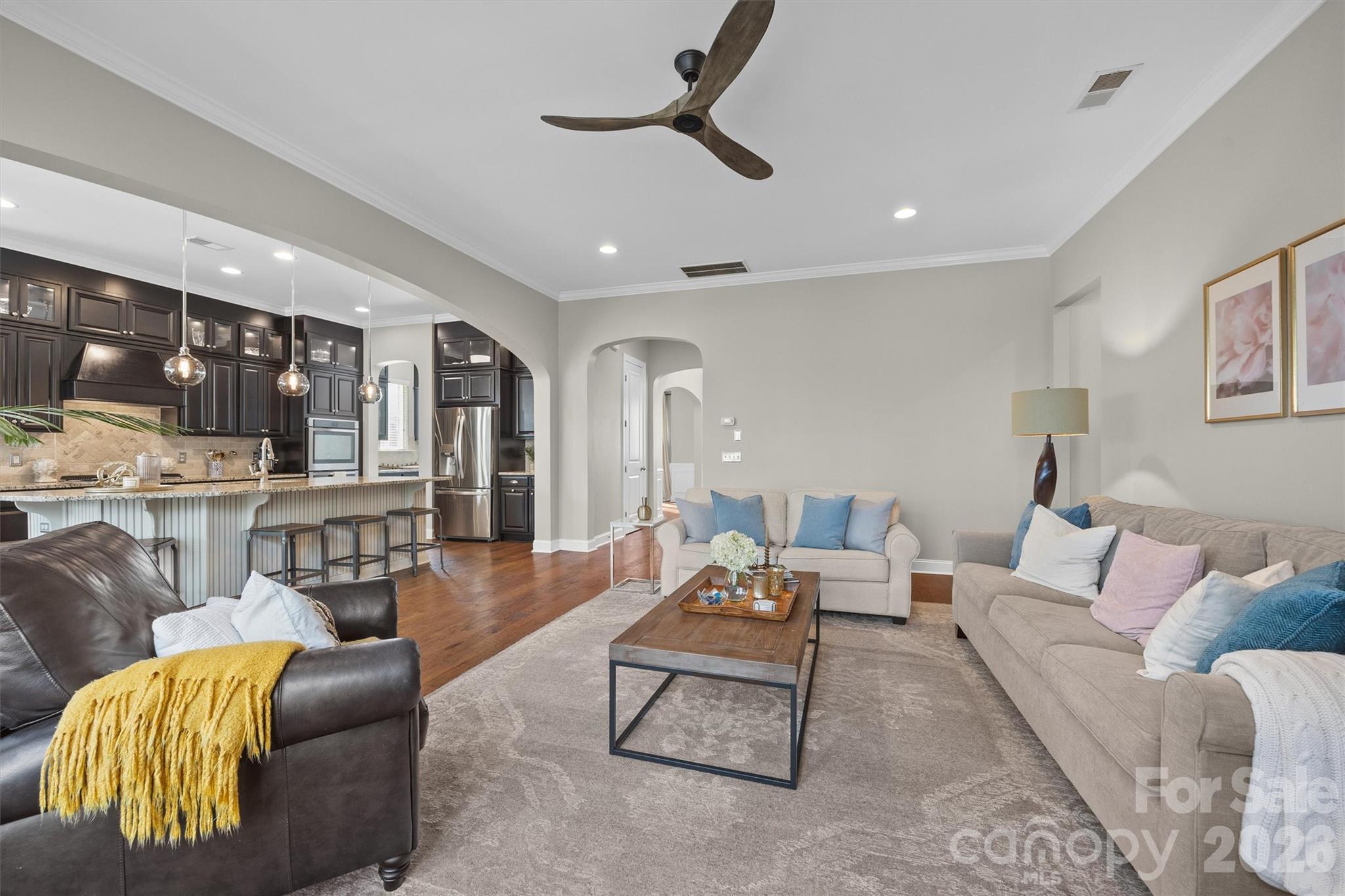 954 Castlewatch Drive Fort Mill, SC 29708 - Photo 9 of 45 a living room with furniture ceiling fan and a rug
