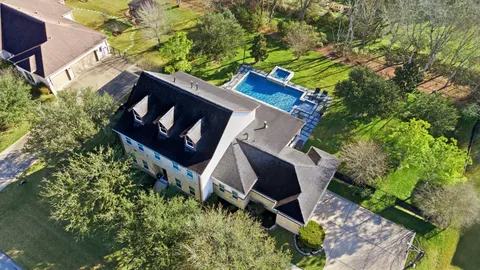 a backyard of a house with lots of green space
