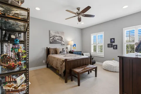 a bedroom with a bed furniture and window