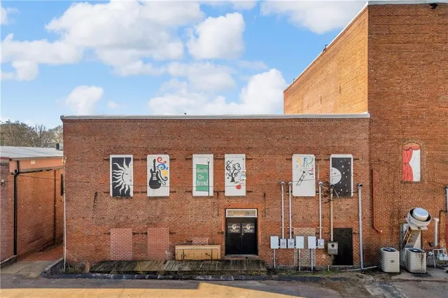 a front view of a building with many windows