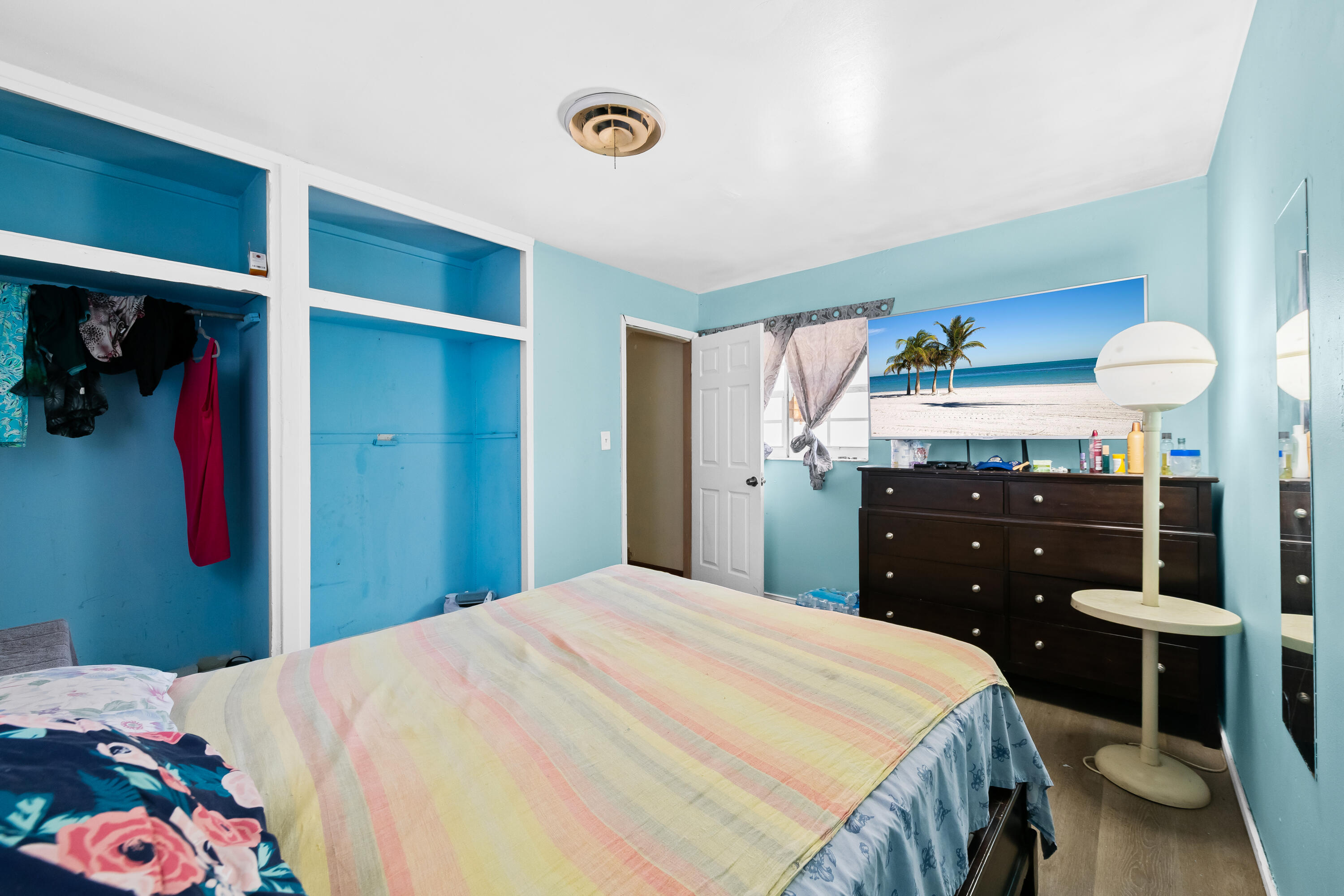 101 Northwest 18th Street Pompano Beach, FL 33060 - Photo 12 of 23 a bedroom with a bed and a cabinets