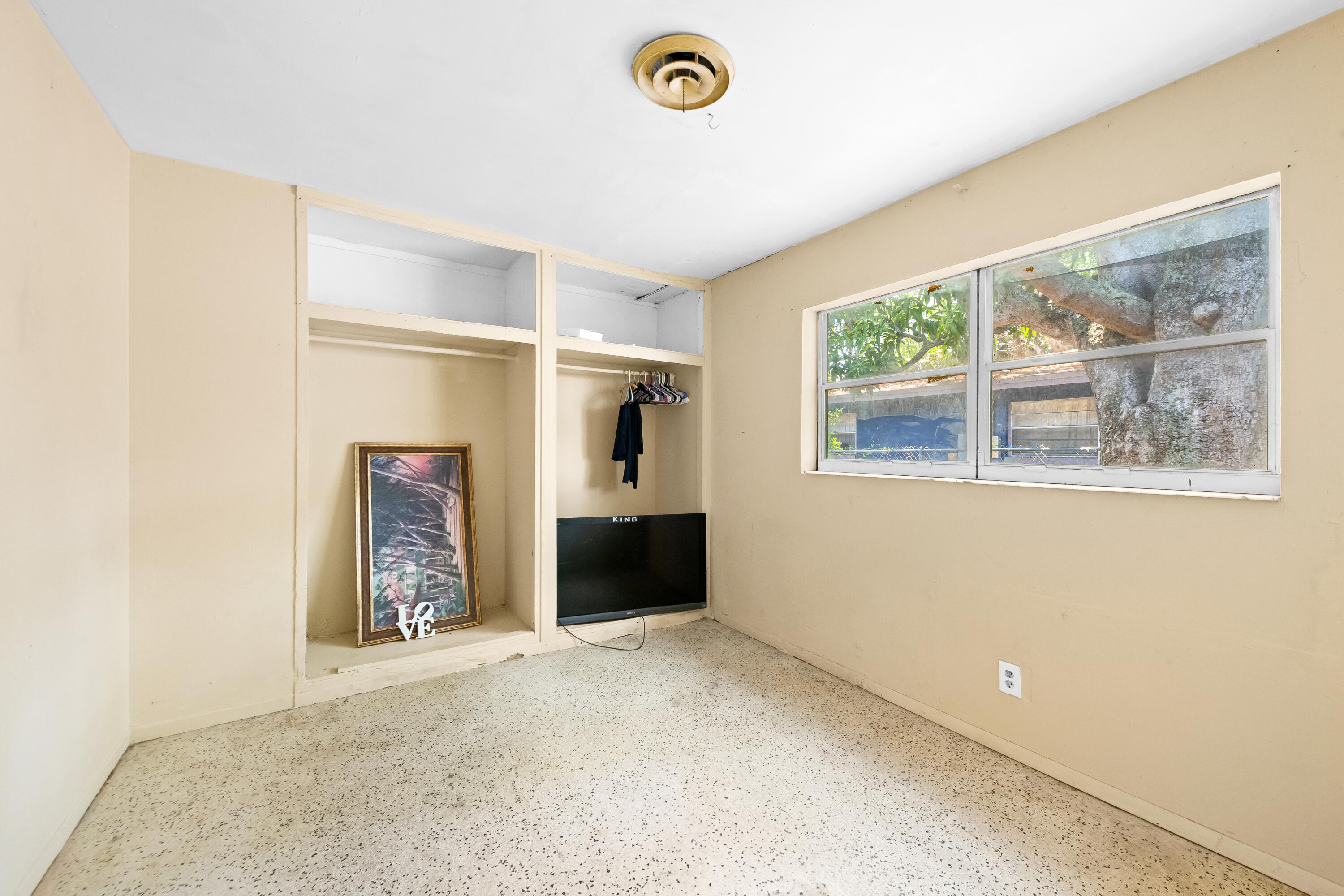 101 Northwest 18th Street Pompano Beach, FL 33060 - Photo 13 of 23 a view of an empty room with a window