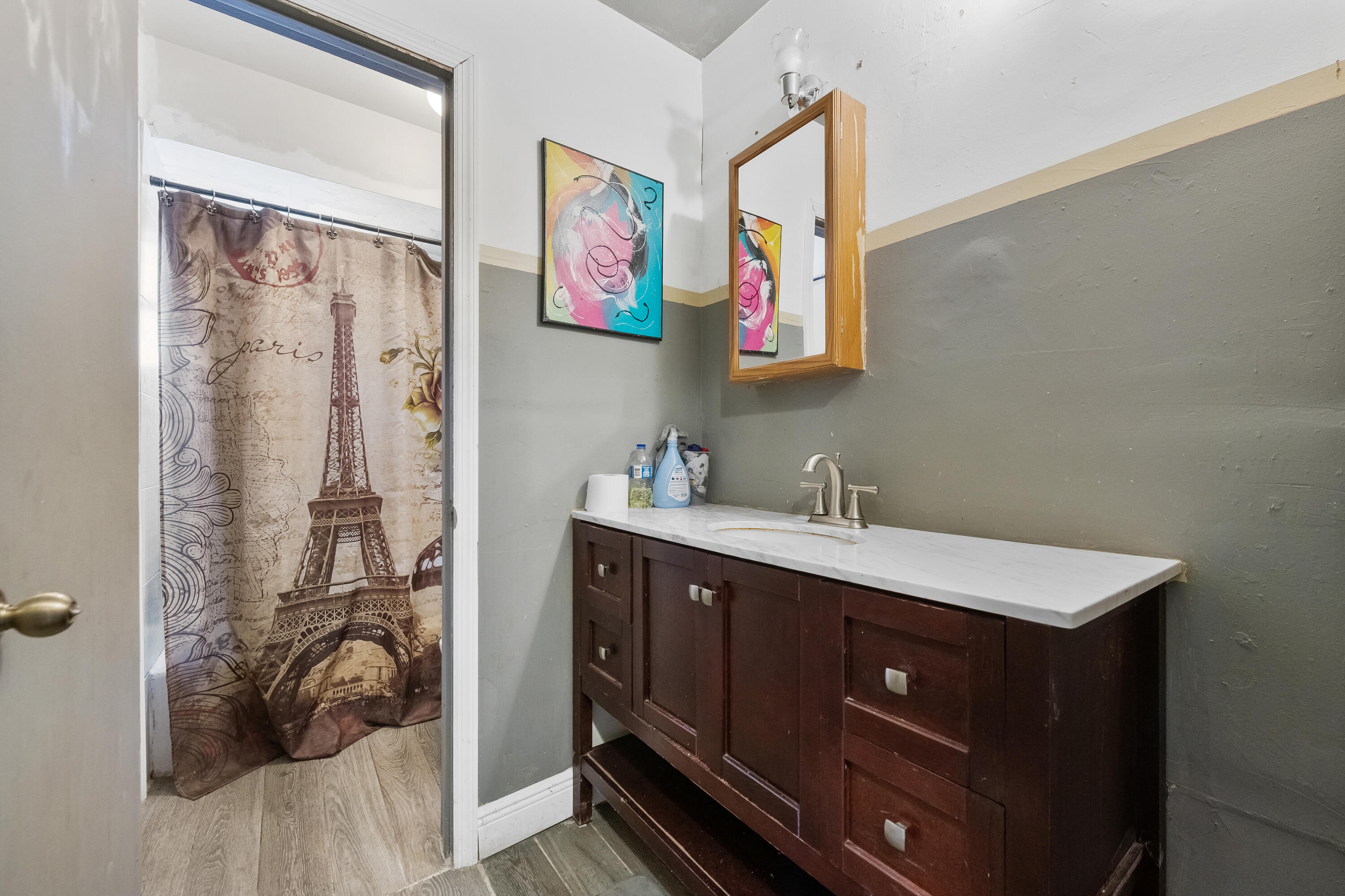 101 Northwest 18th Street Pompano Beach, FL 33060 - Photo 17 of 23 a spacious bathroom with a sink and a mirror