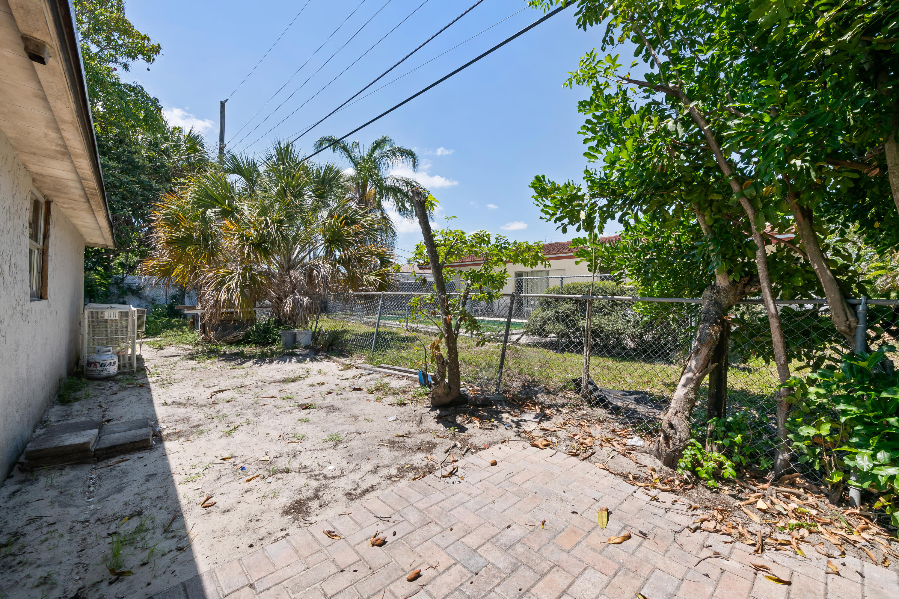 101 Northwest 18th Street Pompano Beach, FL 33060 - Photo 21 of 23 a backyard of a house with lots of green space