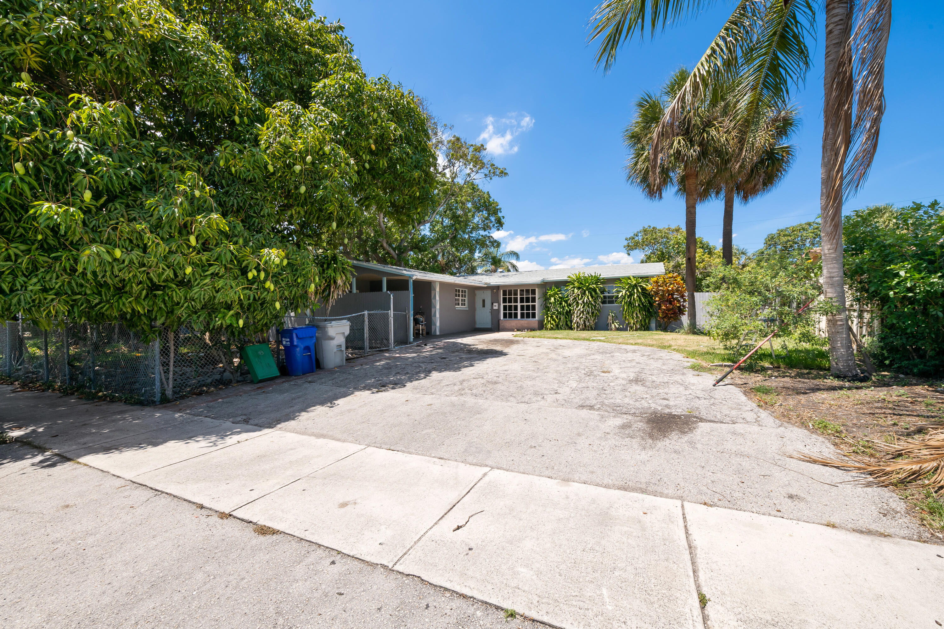 101 Northwest 18th Street Pompano Beach, FL 33060 - Photo 23 of 23 a view of a house with a yard and a garage