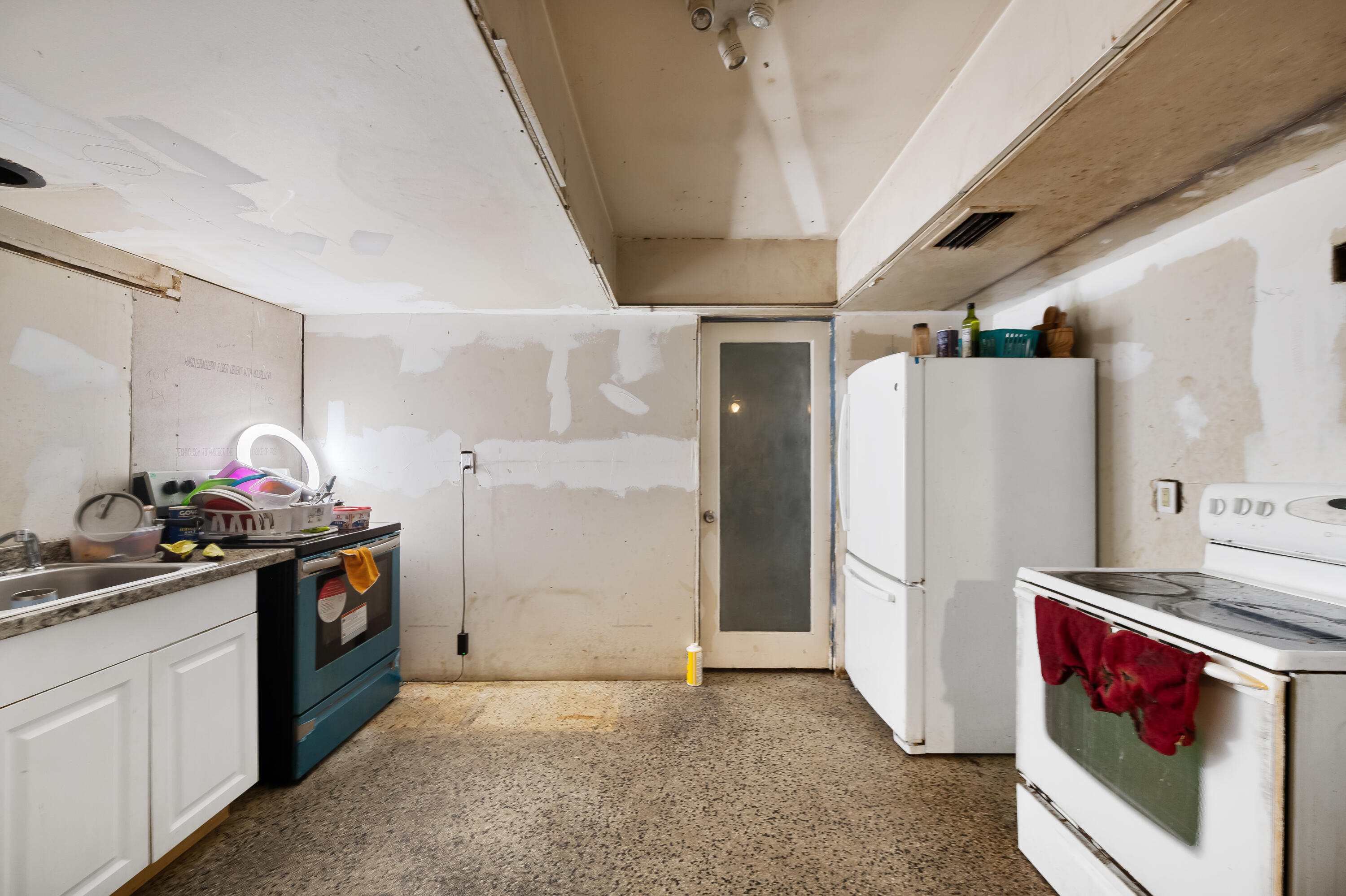 101 Northwest 18th Street Pompano Beach, FL 33060 - Photo 6 of 23 a kitchen with refrigerator and stove