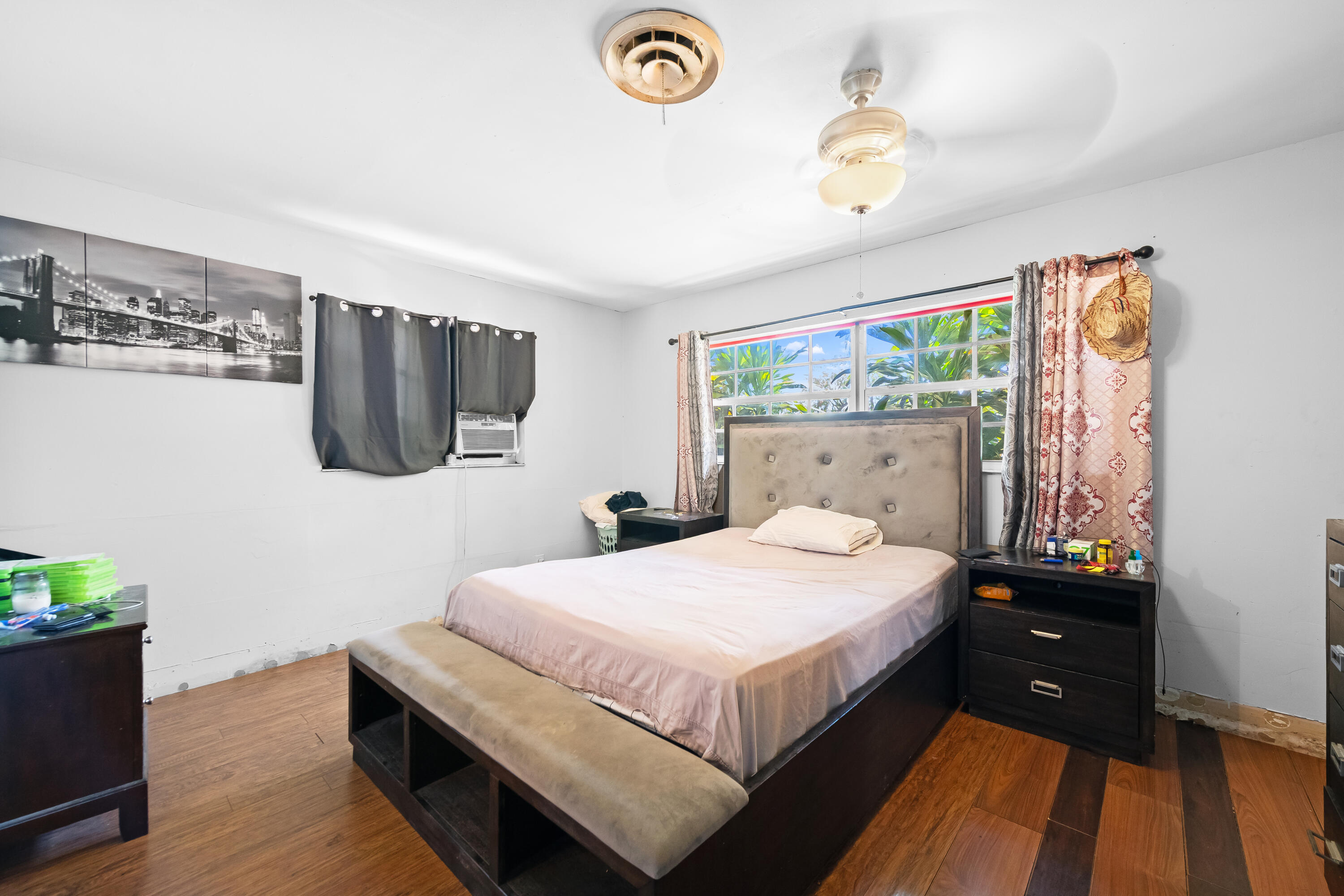 101 Northwest 18th Street Pompano Beach, FL 33060 - Photo 8 of 23 a bedroom with a bed and a table
