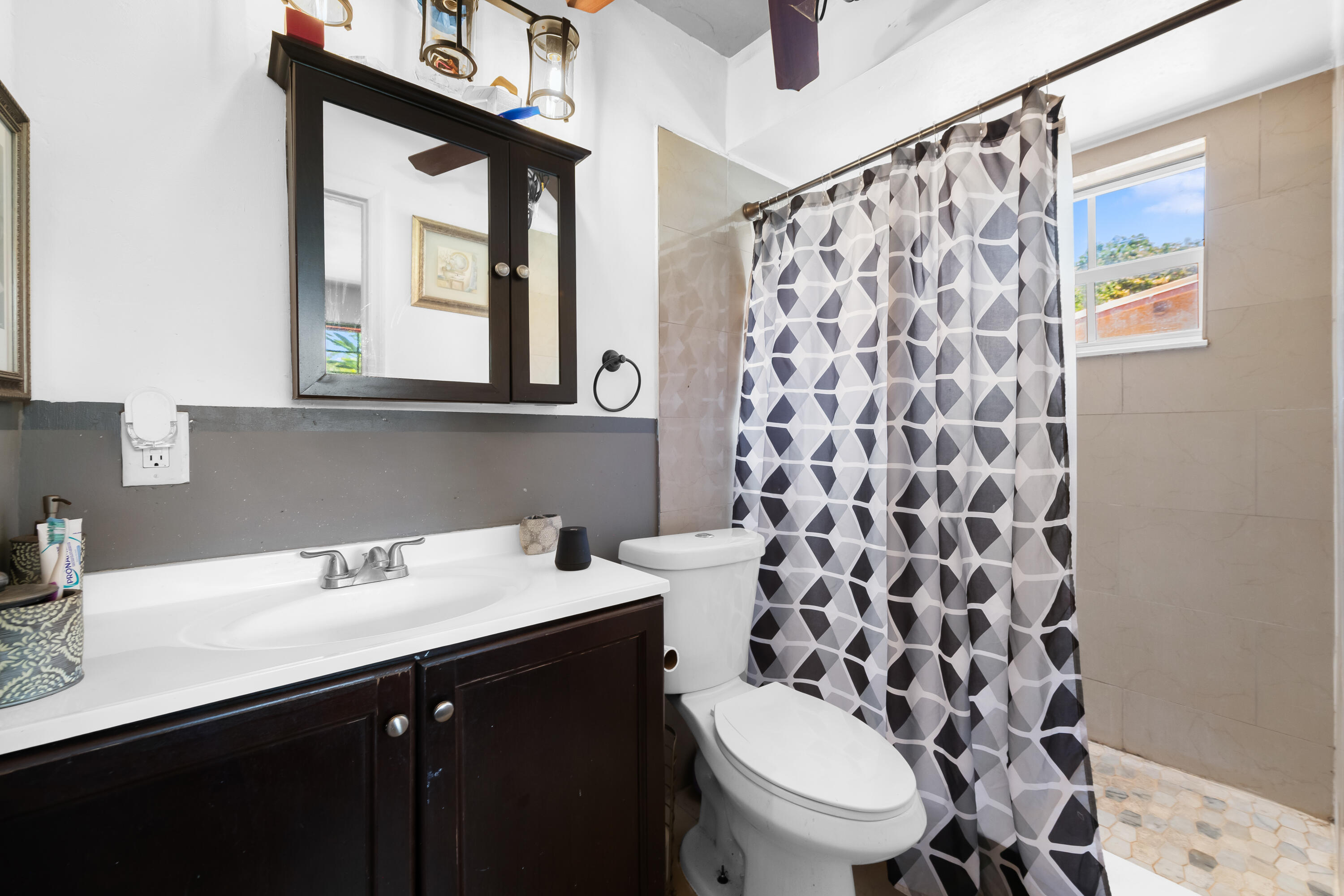101 Northwest 18th Street Pompano Beach, FL 33060 - Photo 10 of 23 a bathroom with a sink and a mirror
