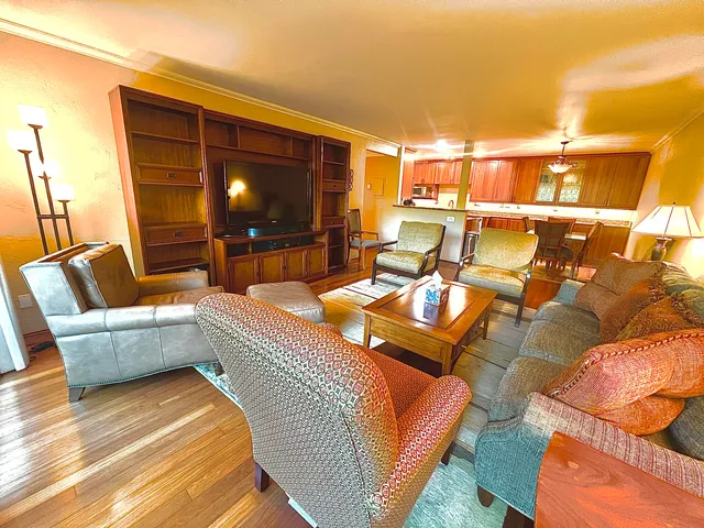 a balcony with couch and outdoor view