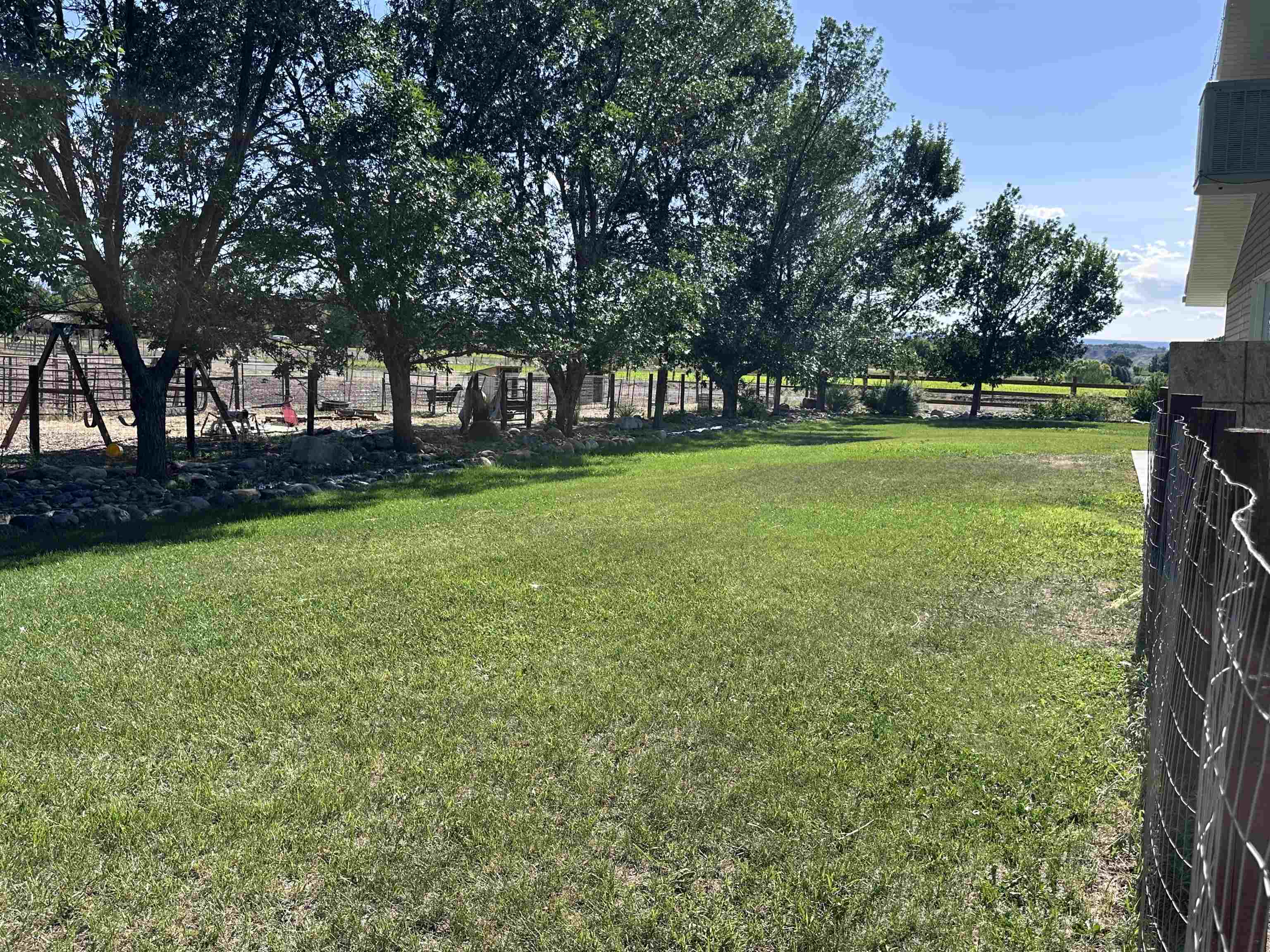 9456 6075th Road Montrose, CO 81403 - Photo 33 of 36 a huge green field with lots of trees