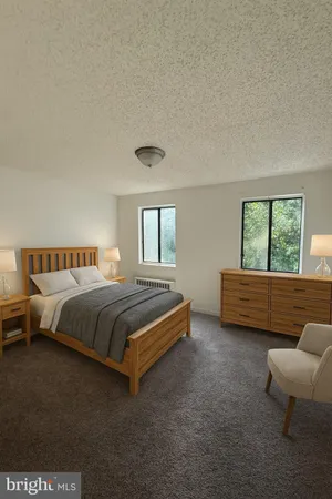 a bedroom with a bed and a couch