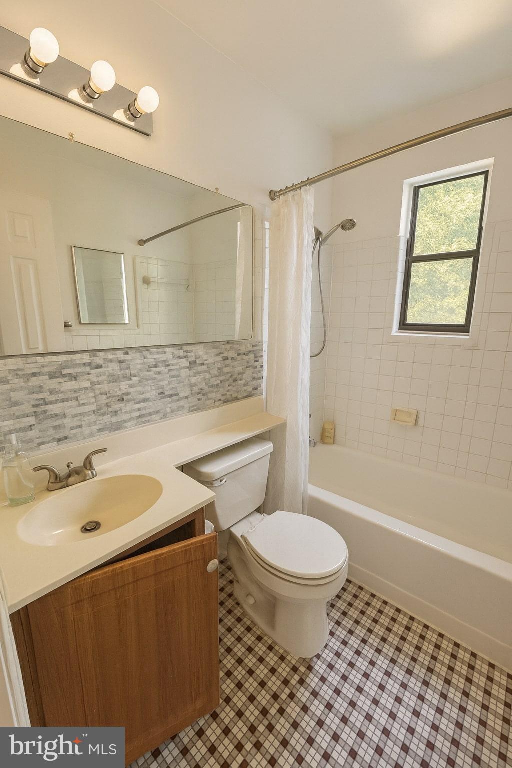 4725 1st Street Southwest, Unit 303 Washington, DC 20032 - Photo 5 of 17 a bathroom with a sink toilet and shower