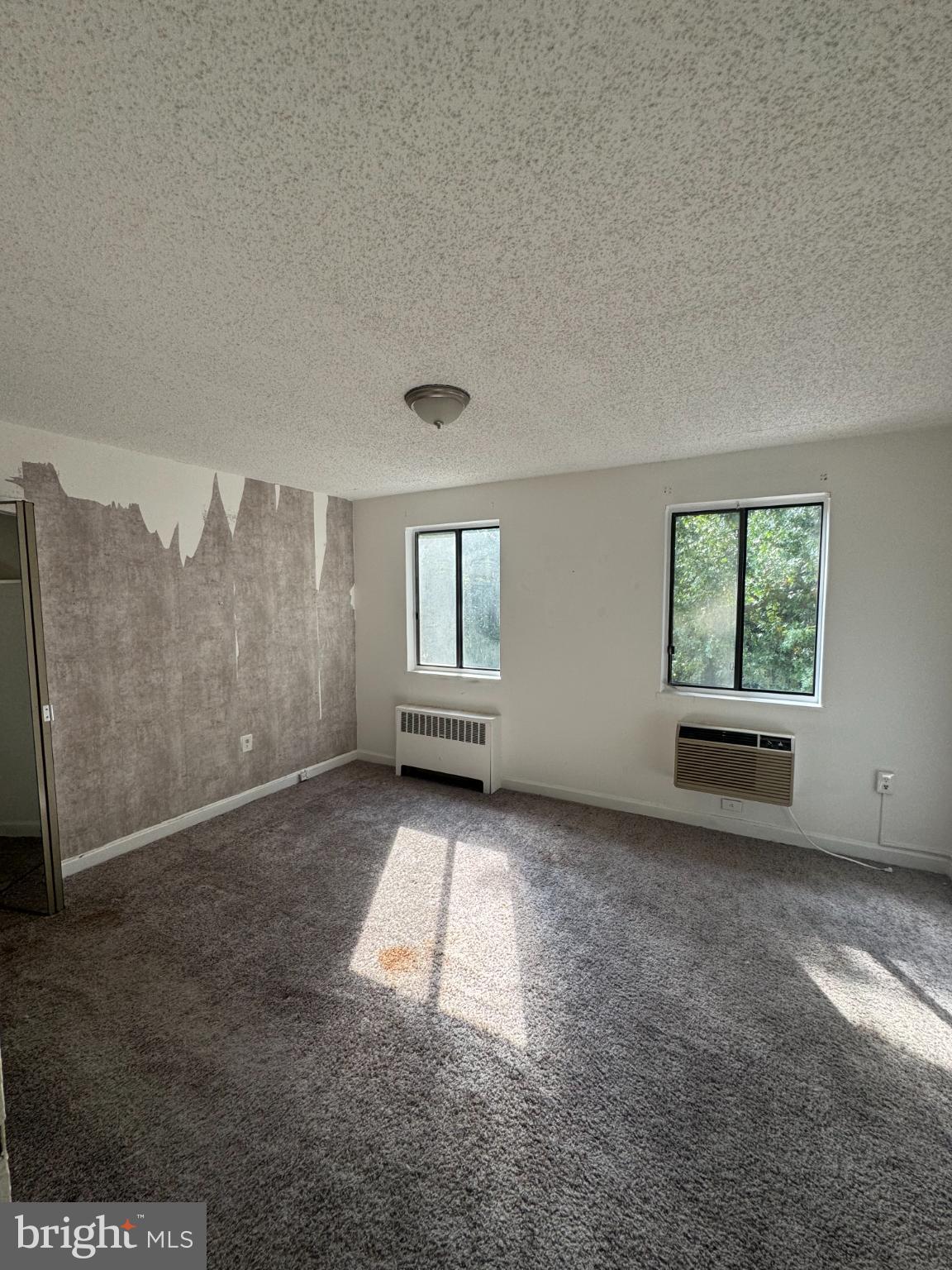 4725 1st Street Southwest, Unit 303 Washington, DC 20032 - Photo 8 of 17 an empty room with windows