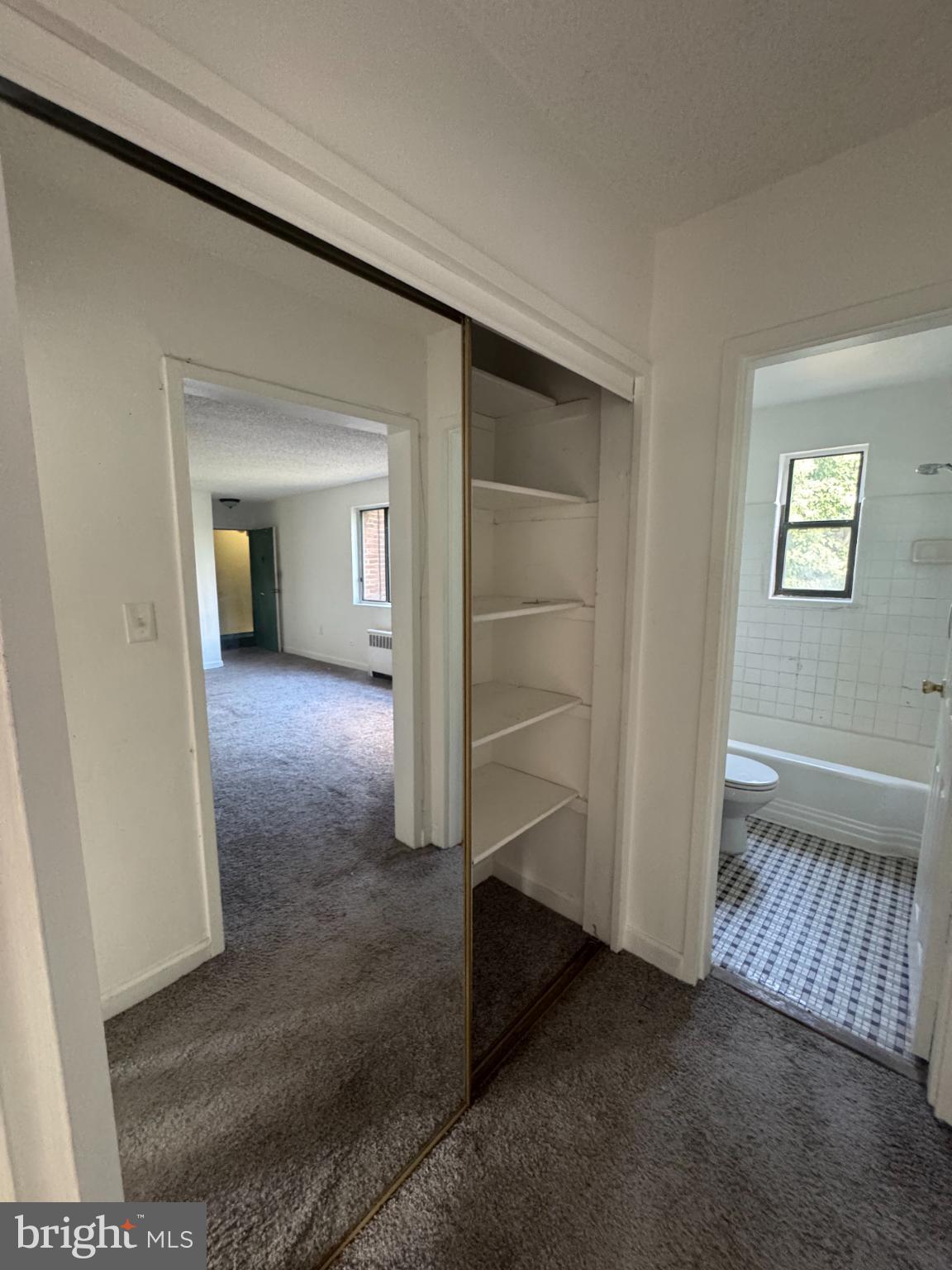 4725 1st Street Southwest, Unit 303 Washington, DC 20032 - Photo 9 of 17 an empty room with windows
