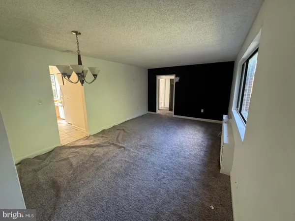 a view of empty room with windows