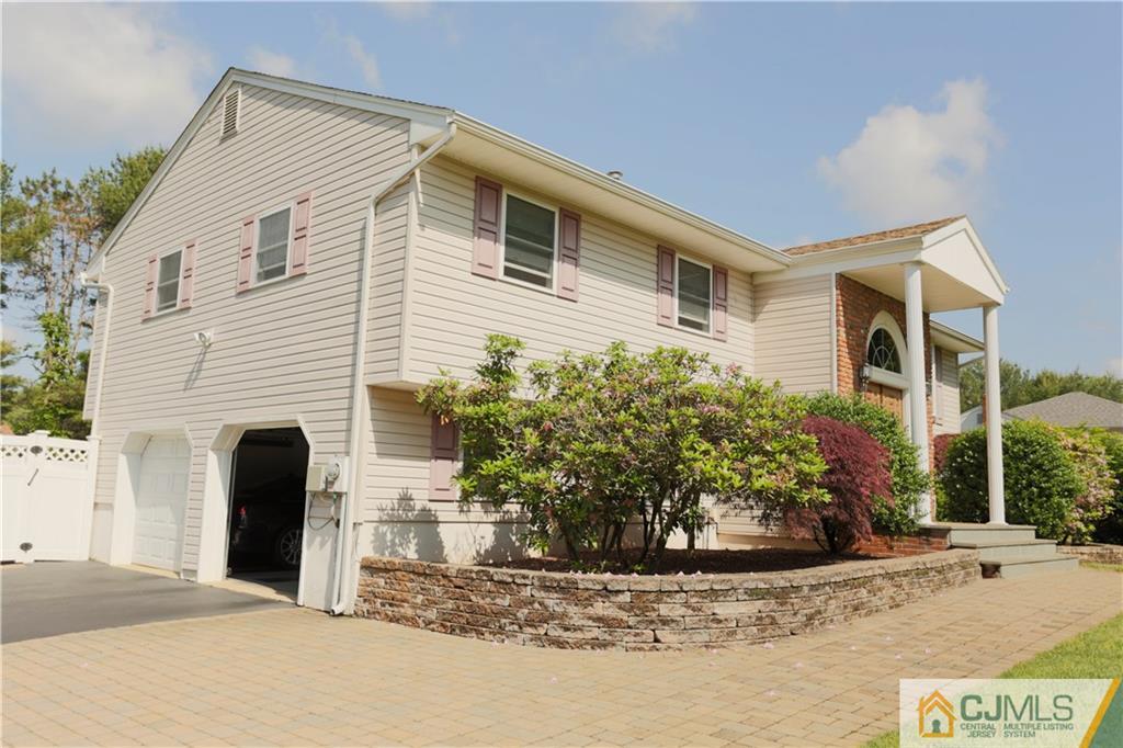 18 Homestead Road Freehold, NJ 07728 - Photo 2 of 32 a front view of a house with garden