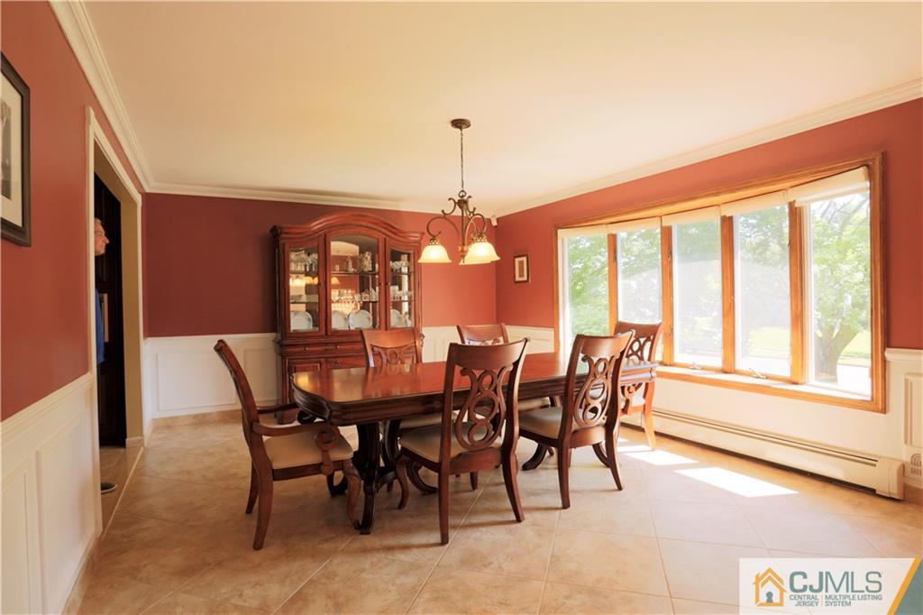 18 Homestead Road Freehold, NJ 07728 - Photo 13 of 32 a view of a dining room with furniture window and outside view