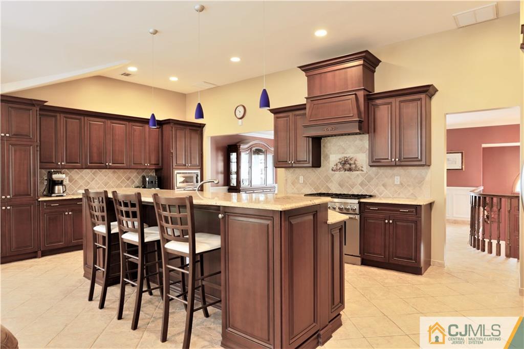 18 Homestead Road Freehold, NJ 07728 - Photo 21 of 32 a kitchen with cabinets a sink and appliances