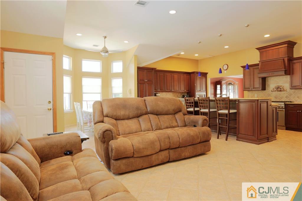 18 Homestead Road Freehold, NJ 07728 - Photo 22 of 32 a living room with furniture and a large window
