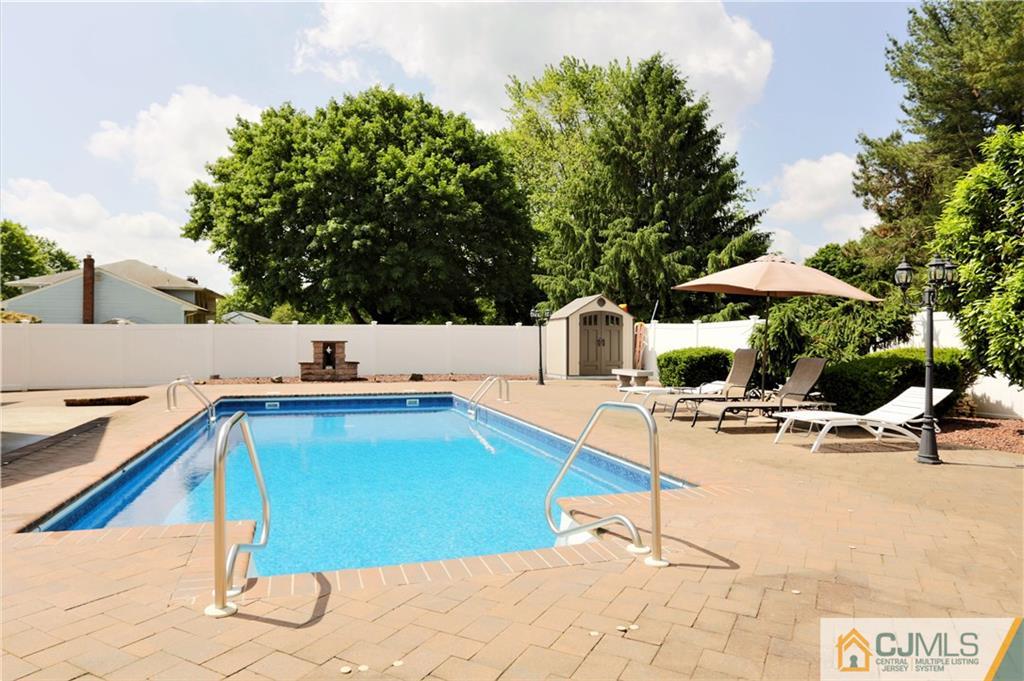 18 Homestead Road Freehold, NJ 07728 - Photo 30 of 32 a view of a swimming pool with lounge chairs