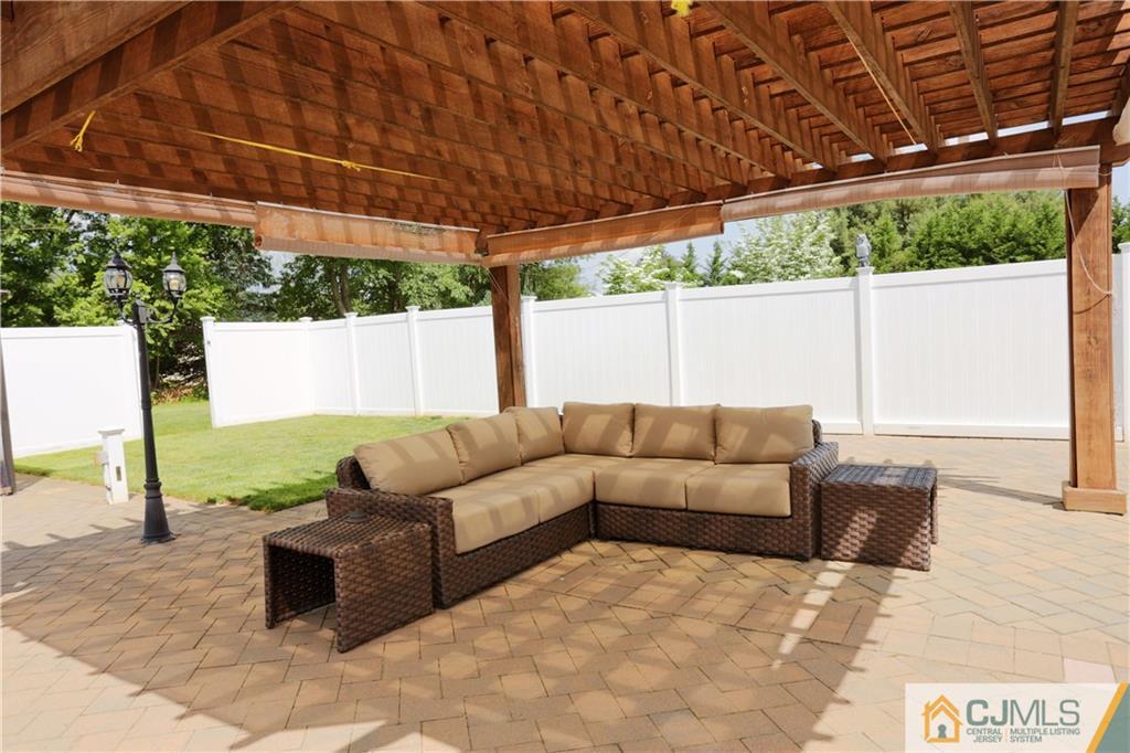 18 Homestead Road Freehold, NJ 07728 - Photo 31 of 32 a view of a couches in the patio