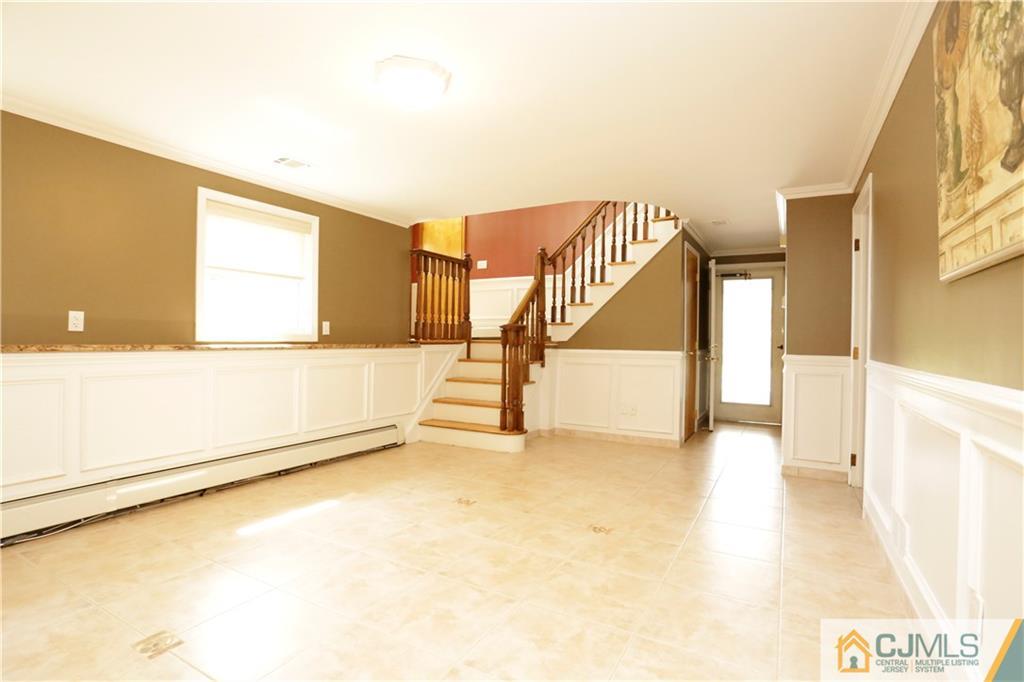 18 Homestead Road Freehold, NJ 07728 - Photo 6 of 32 a view of an empty room with a window