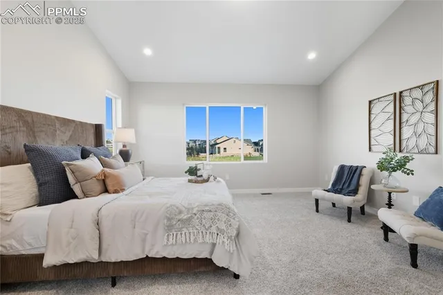 a bedroom with bed and window
