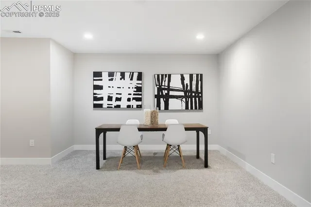 a workspace with furniture and window