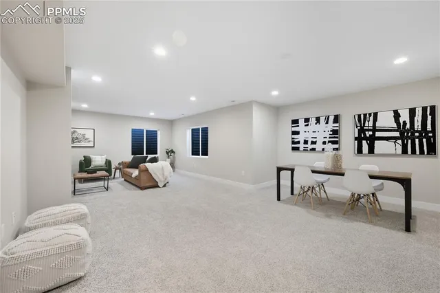 a living room with furniture and a table