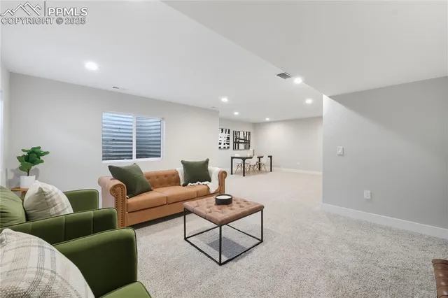a living room with furniture and a table