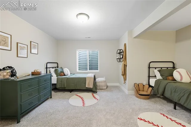 a bedroom with bed and a couch