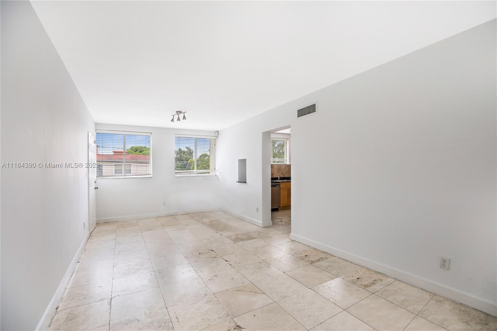 1025 Southwest 7th Avenue, Unit 9 Miami, FL 33129 - Photo 5 of 9 an empty room with windows