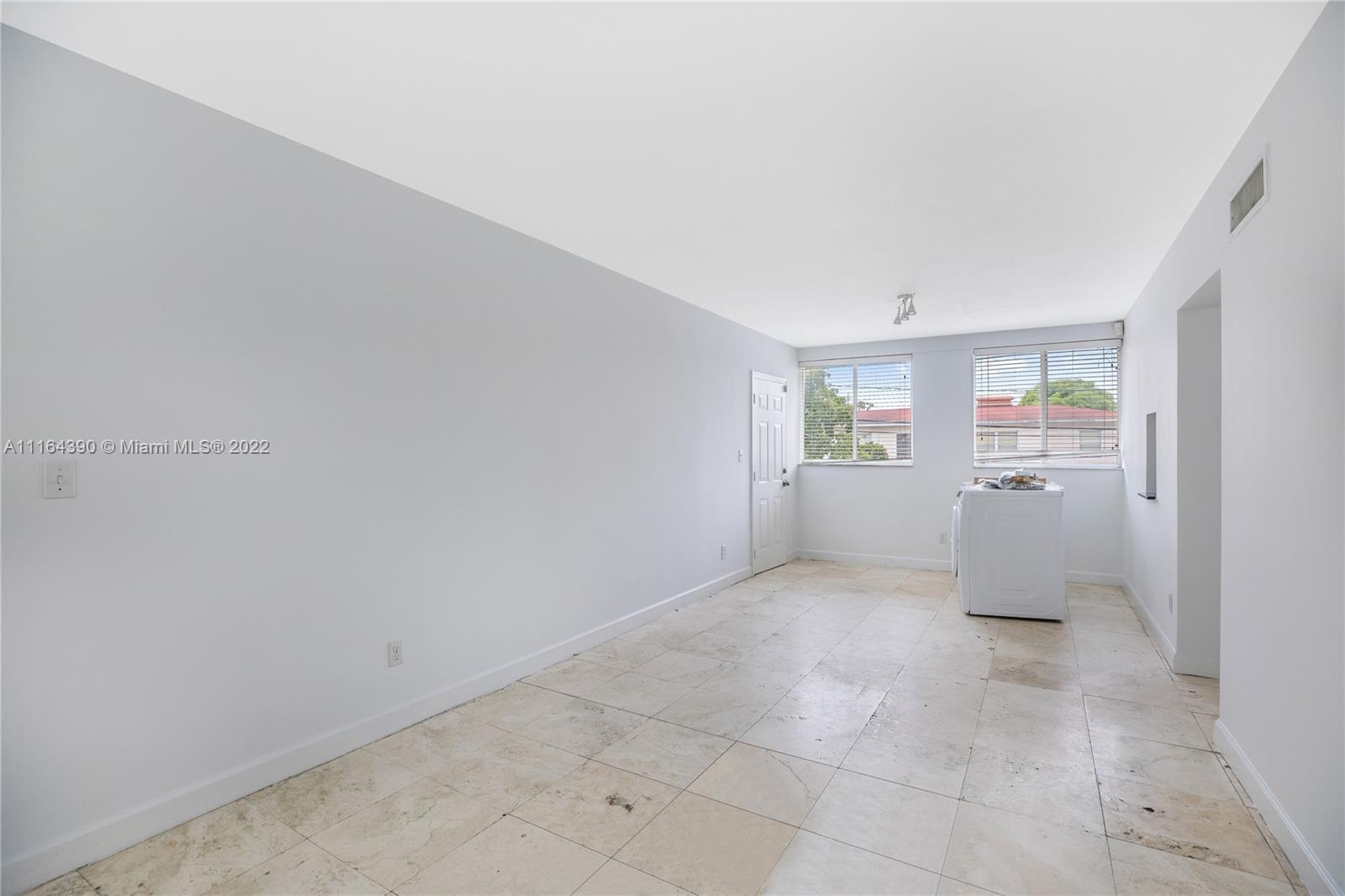 1025 Southwest 7th Avenue, Unit 9 Miami, FL 33129 - Photo 8 of 9 a view of an empty room with a window