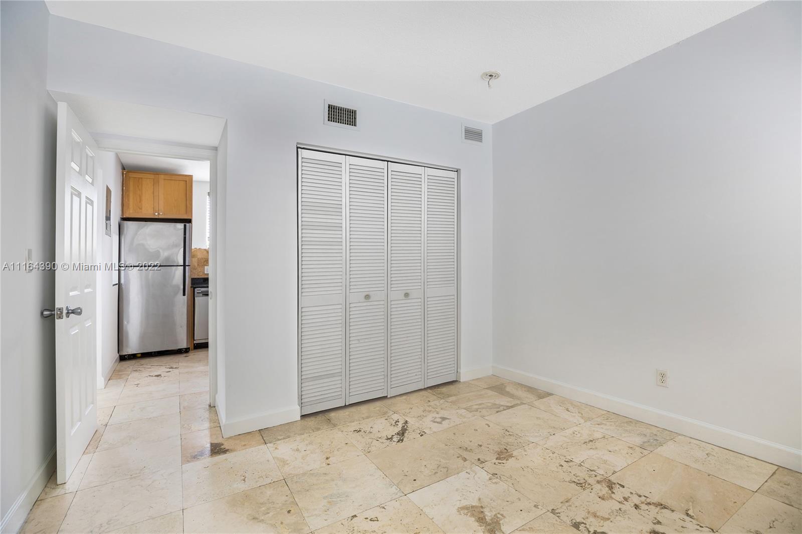 1025 Southwest 7th Avenue, Unit 9 Miami, FL 33129 - Photo 9 of 9 a view of a livingroom with wooden floor and a hallway