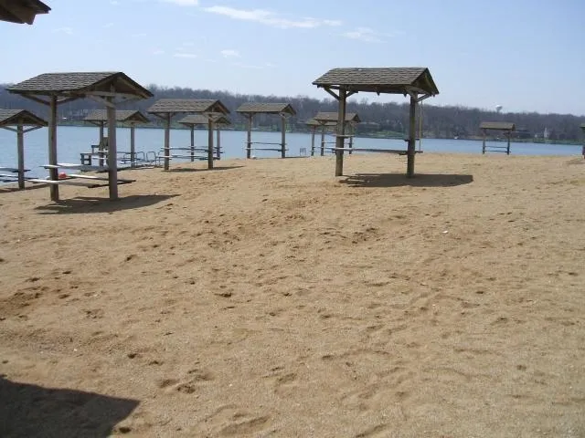 a view of a lake with houses in the back