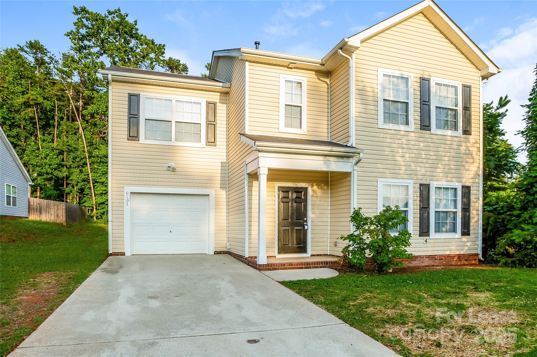 front view of a house and a yard