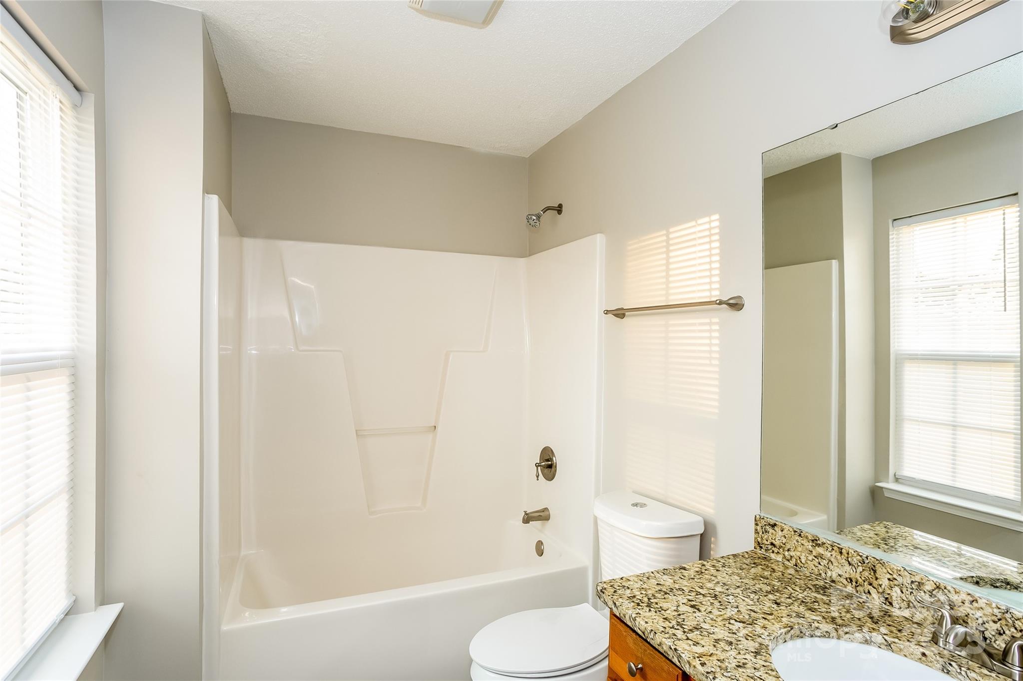 6131 Sid Crane Drive Charlotte, NC 28216 - Photo 11 of 17 a bathroom with a sink toilet and shower