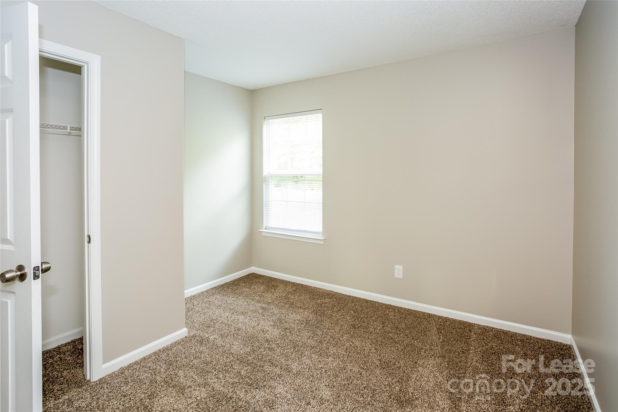 6131 Sid Crane Drive Charlotte, NC 28216 - Photo 12 of 17 a big room with a window
