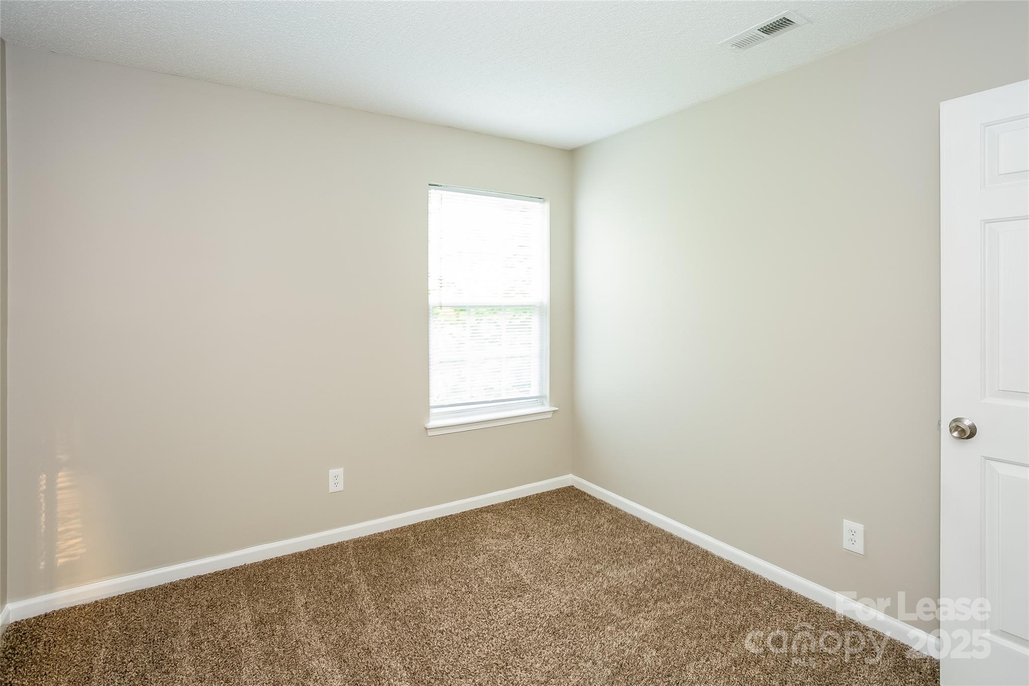 6131 Sid Crane Drive Charlotte, NC 28216 - Photo 13 of 17 an empty room with a window