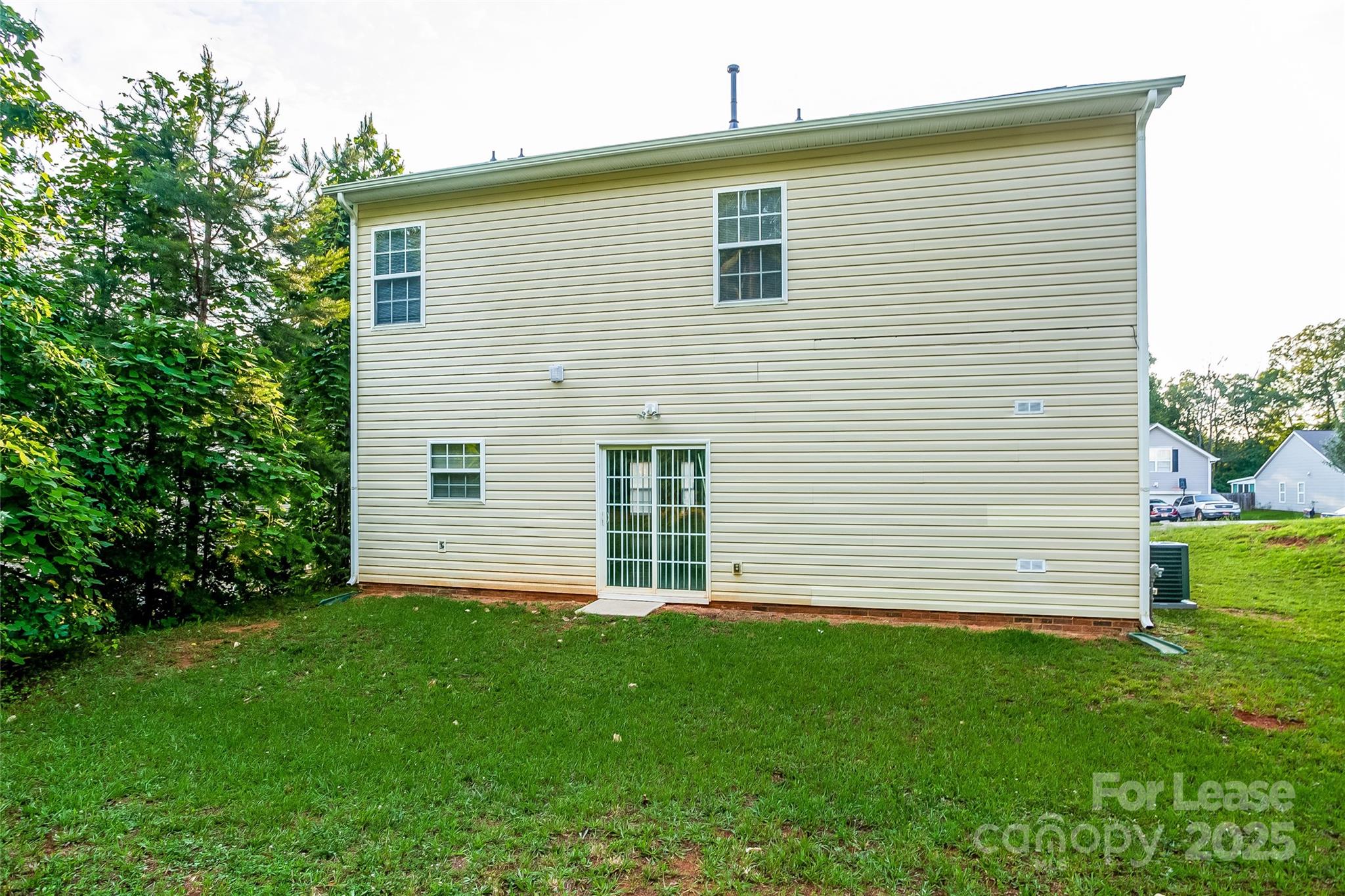 6131 Sid Crane Drive Charlotte, NC 28216 - Photo 17 of 17 a front view of a house with a garden