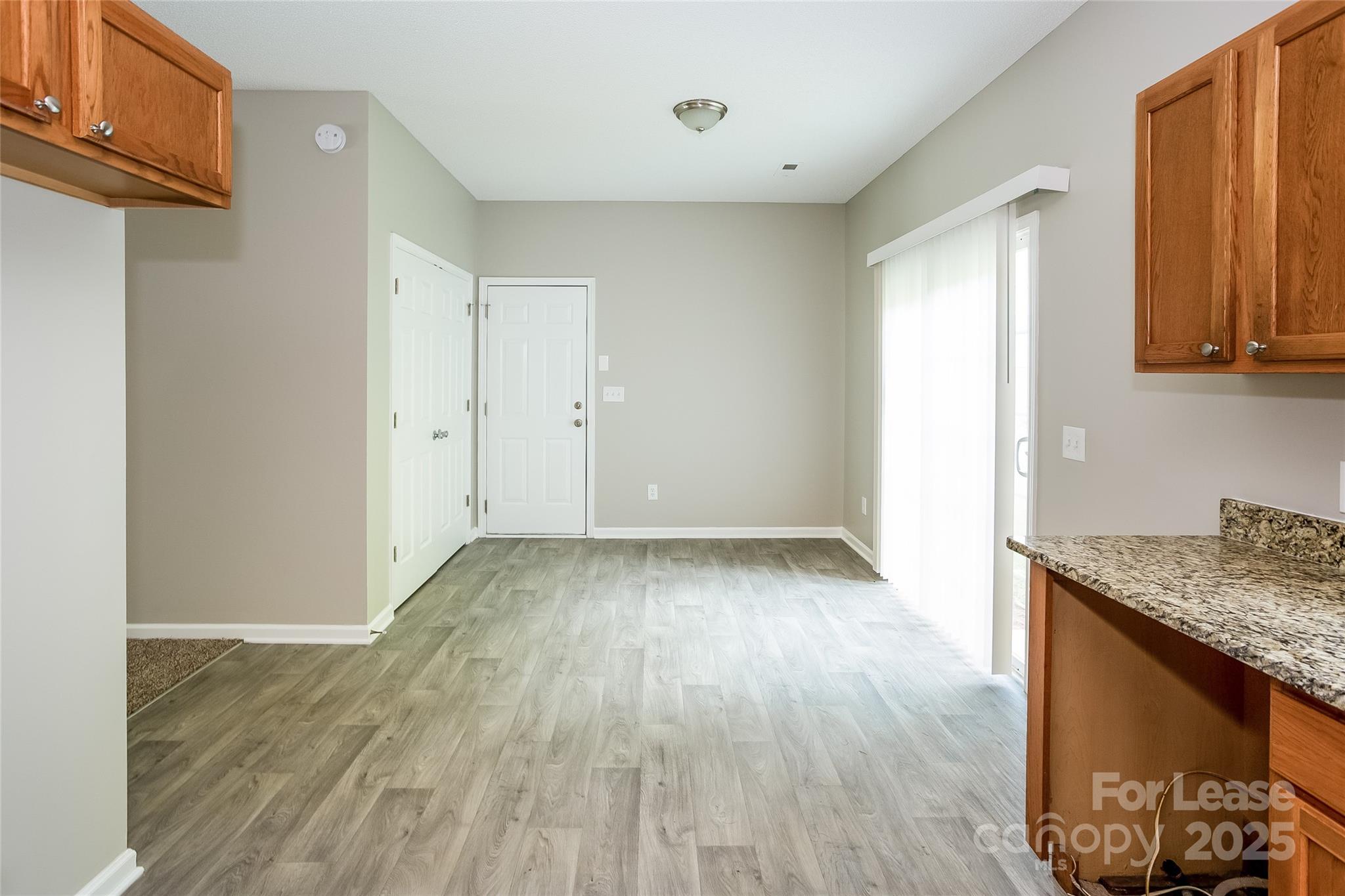 6131 Sid Crane Drive Charlotte, NC 28216 - Photo 6 of 17 a view of a kitchen with wooden floor and a sink