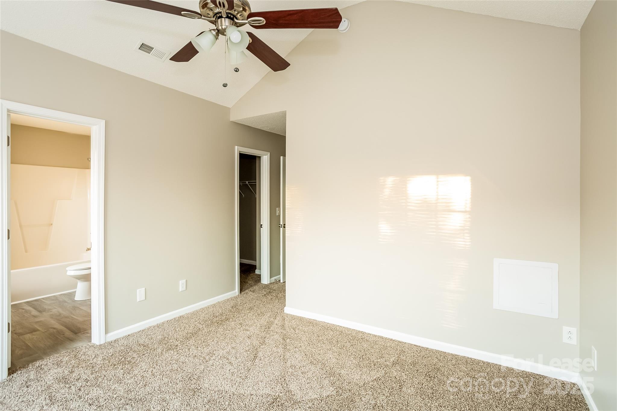 6131 Sid Crane Drive Charlotte, NC 28216 - Photo 8 of 17 a view of a livingroom with a ceiling fan and window