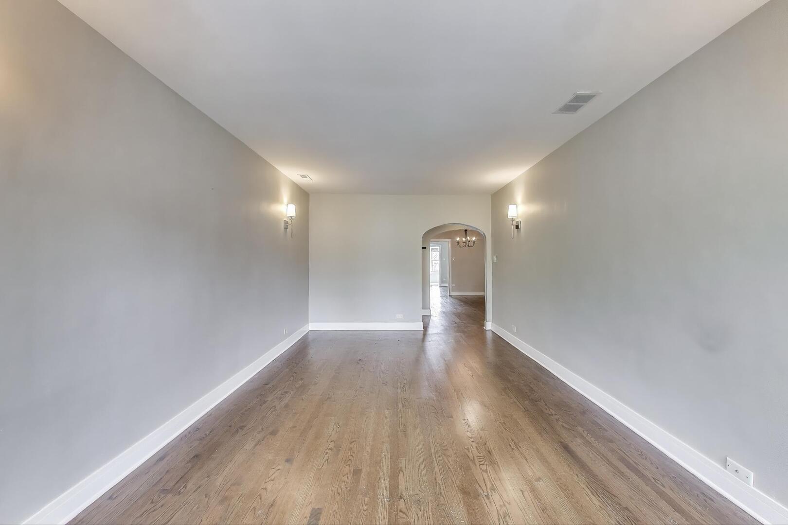 1451 West Warner Avenue, Unit 2 Chicago, IL 60613 - Photo 5 of 23 a view of empty room with wooden floor