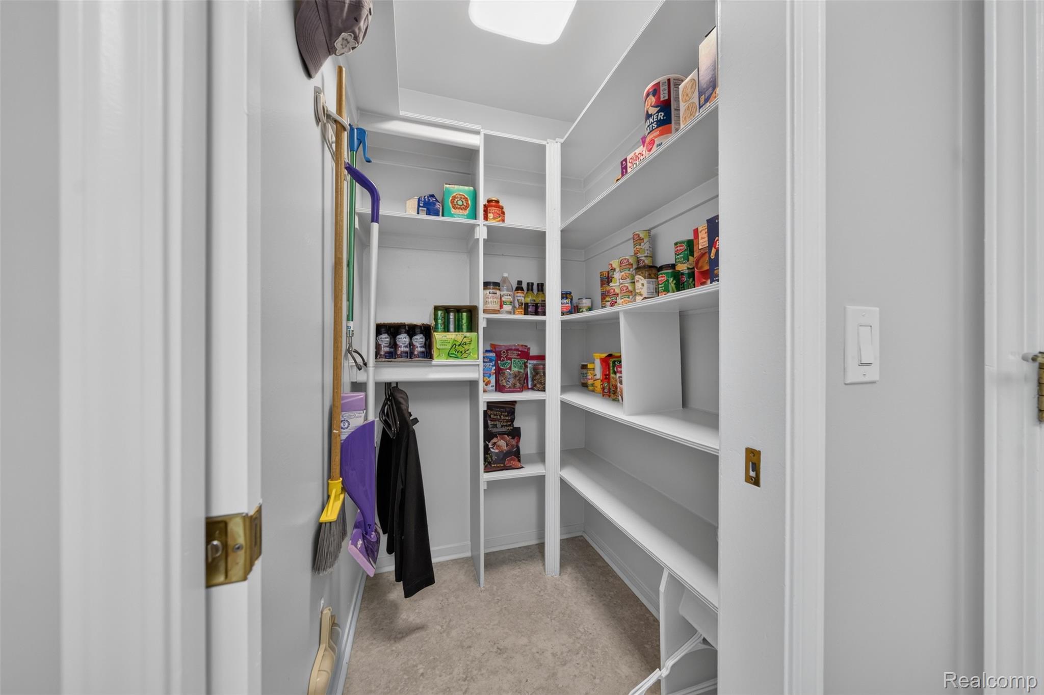 1236 Chaffer Drive Rochester, MI 48306 - Photo 24 of 76 Walk-in pantry featuring extensive built-in shelving, light-colored flooring, and recessed lighting
